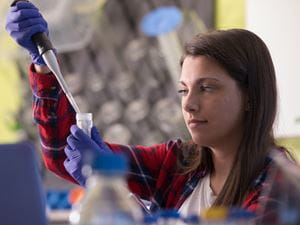 Endicott Student with test tube