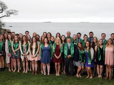 group of honors students getting picture taken outside at honors gala