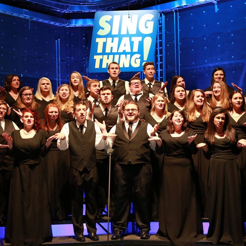 group of students performing in a singing showcase