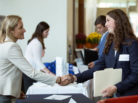 Endicott student networks at meet the firm event