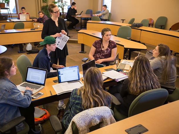 Endicott College communication students and professor in a classroom