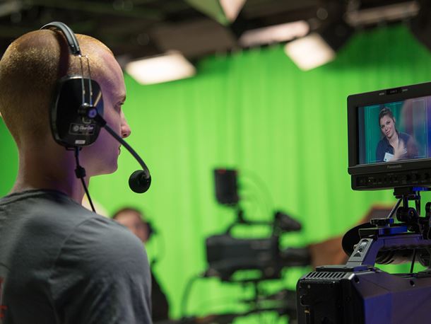 An Endicott College student behind the camera at Orientation