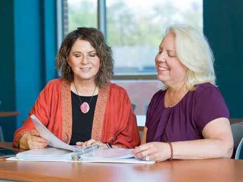 Endicott College teacher and student in a classroom