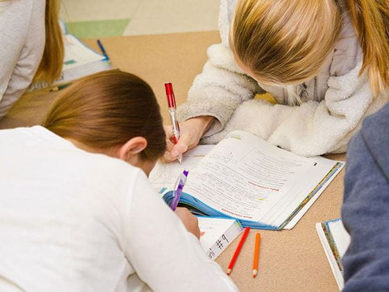 Students read in Endicott College student teacher classroom