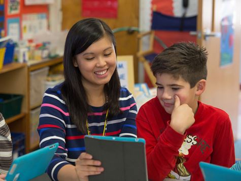 An Endicott College student teacher with her student