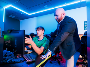 Brendan Hall with student in The Endicott Esports Lab
