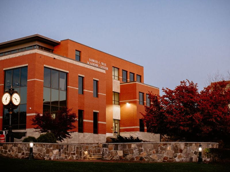 Night exterior of the Samuel C. Wax Academic Center at Endicott College