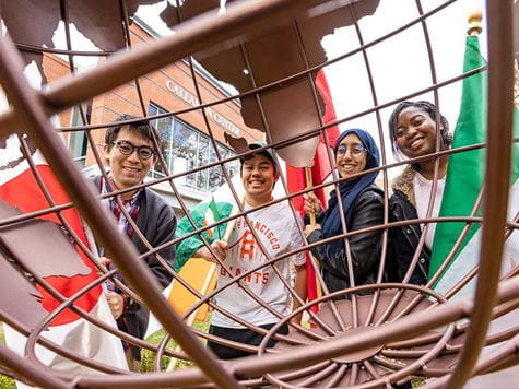 Students with globe and flags 