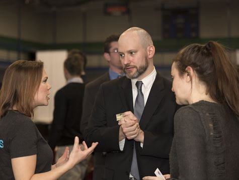 professor and students at career/job fair