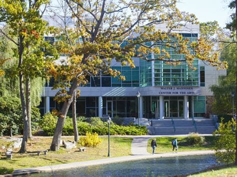 image of manninen arts center shot through the trees from a distance