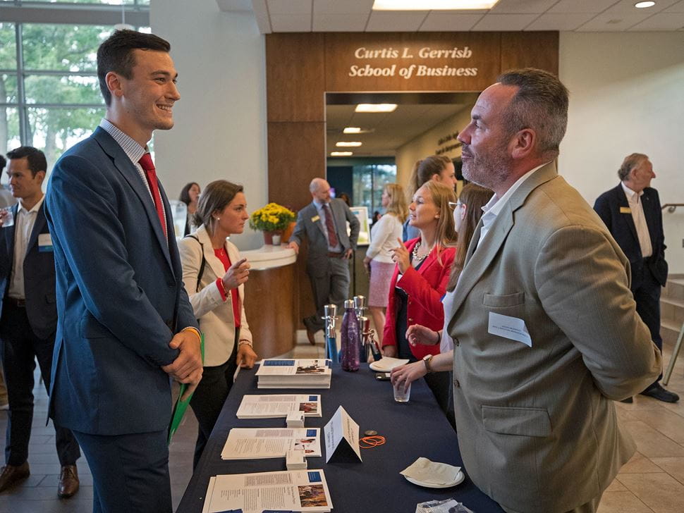 Account student interacting with a recruiter at Meet the Firms