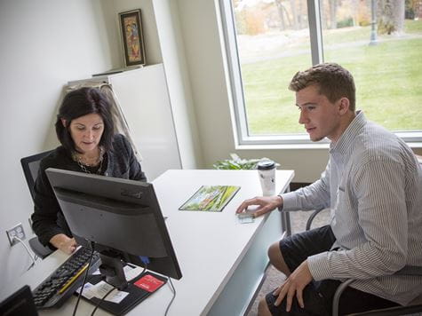 professor advising student in her office