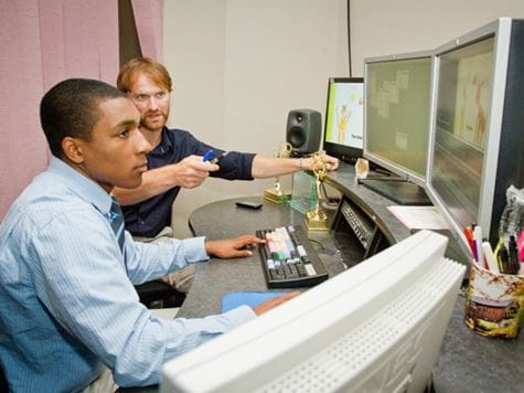 student mentoring a fellow student