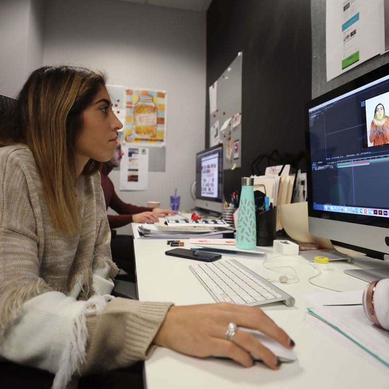 Alexandra Del Tufo works on design work at her semester-long internship site, King Fish Media 