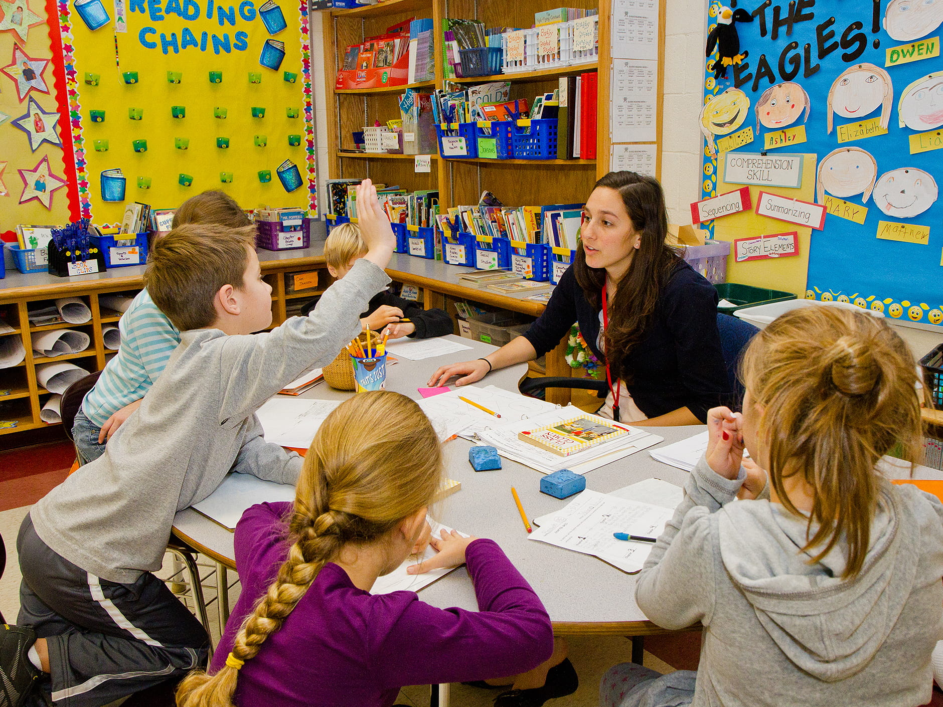 Student teacher preparing students in literacy group 