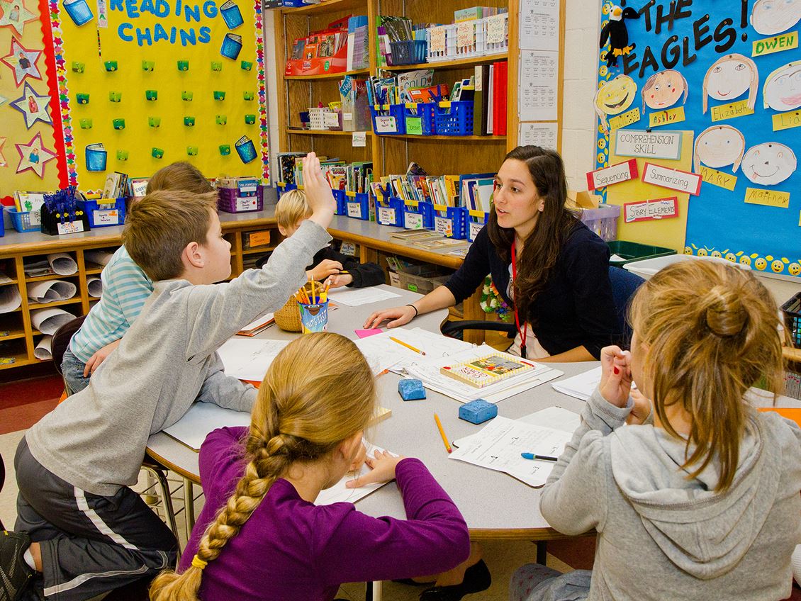 Student teacher preparing students in literacy group 