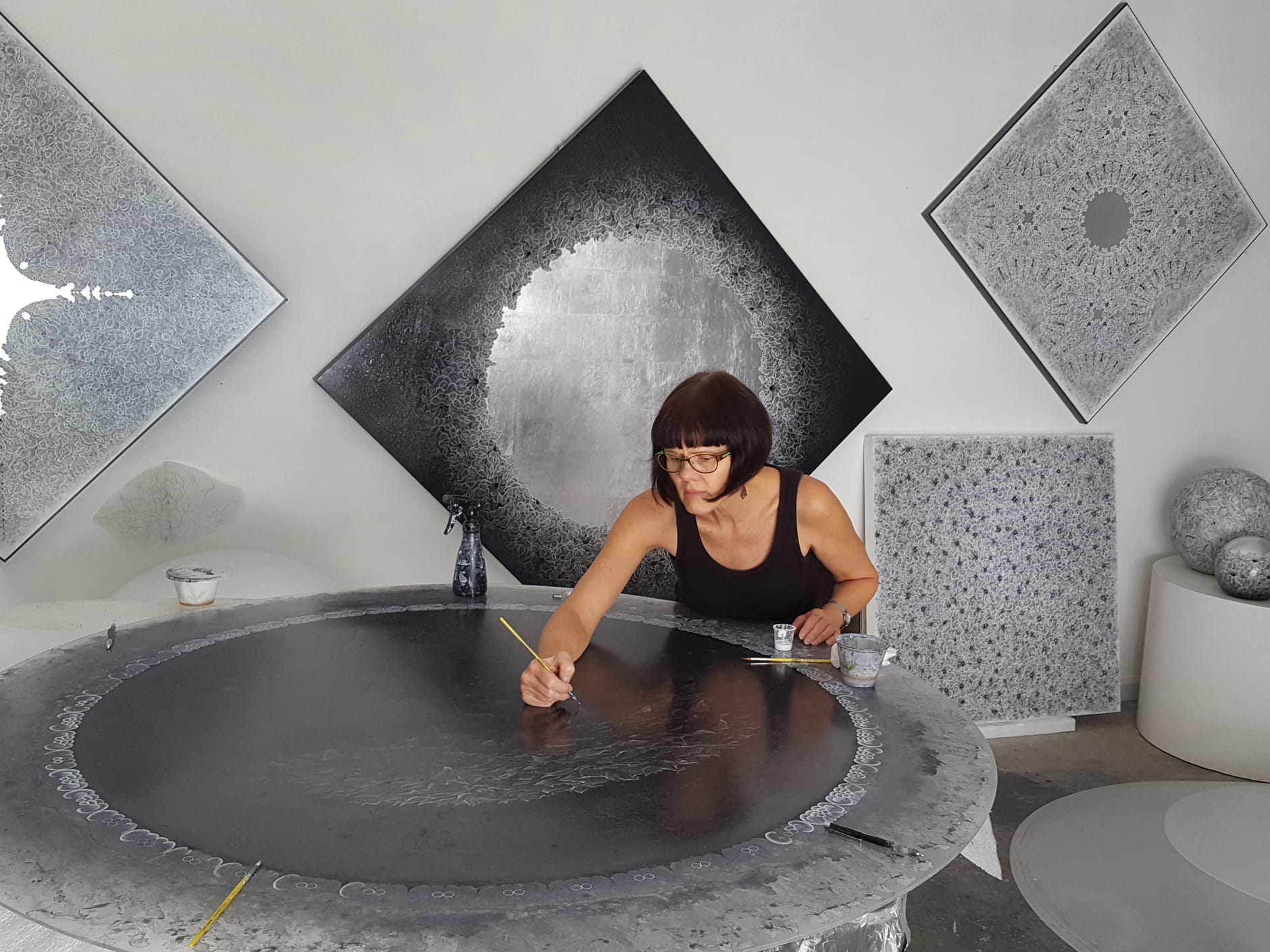 Artist Carol Pusa works in her studio