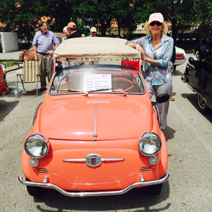 Endicott alumnae Myrt Harper Rose stands by a car. 