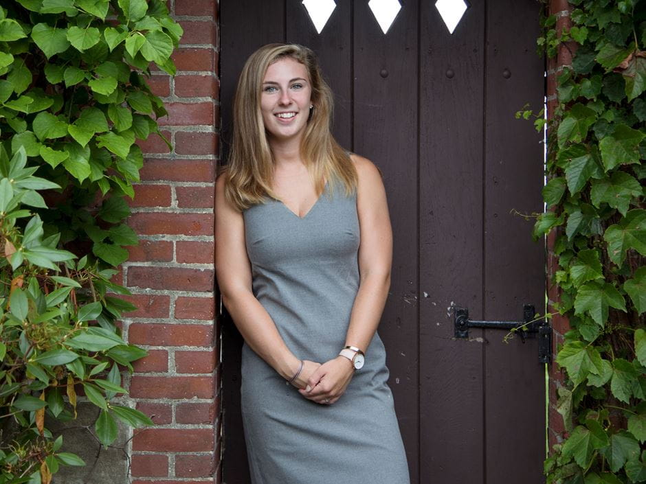 Katy Sweetland '18 standing in front of the Misselwood doorway.