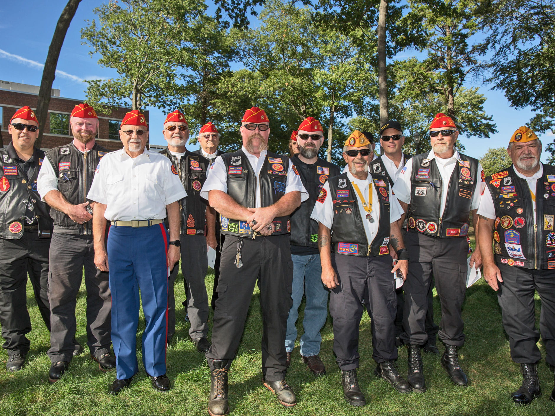 A group of proud veterans stand outside