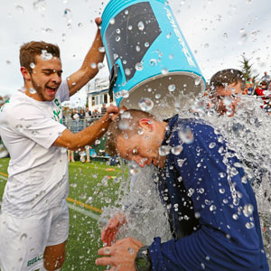 Dario Neukom '18 M'19 and men's soccer coach Joe
Calabrese celebrating the 2017 CCC Championship