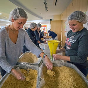Allison Tantone '21 serving meals