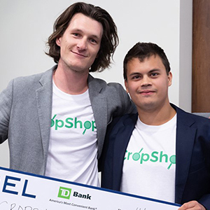 A.J. Marcinek '19 and Cam Bleck '19, of CropShop,
stand with their grand prize at last year's competition