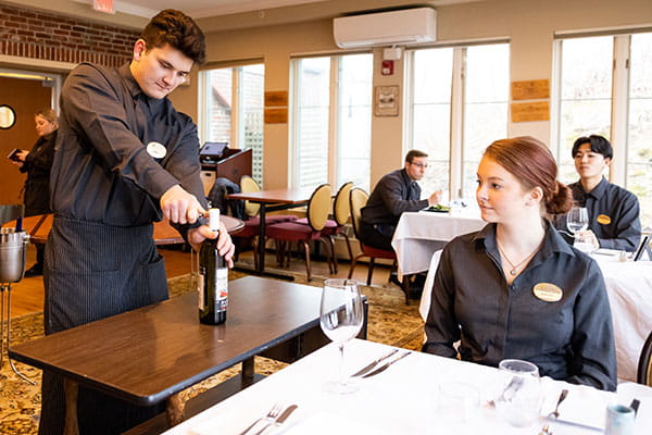 Students practicing serve in the La Chanterelle dry run