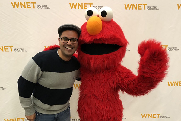 Daniel Quitério ’03 with Elmo