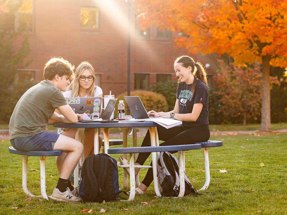 Students sitting on benches at Endicott College