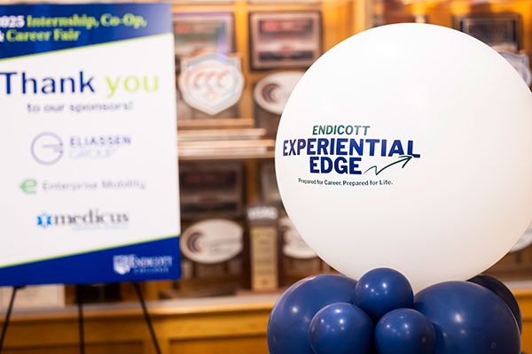 A Balloon and signage with Endicott Experiential Edge information