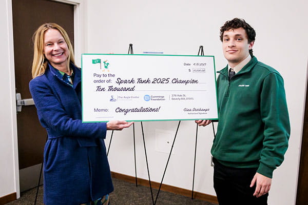 Provost Dr. Sara Quay with Elijah Wilson ’25 receiving the top prize