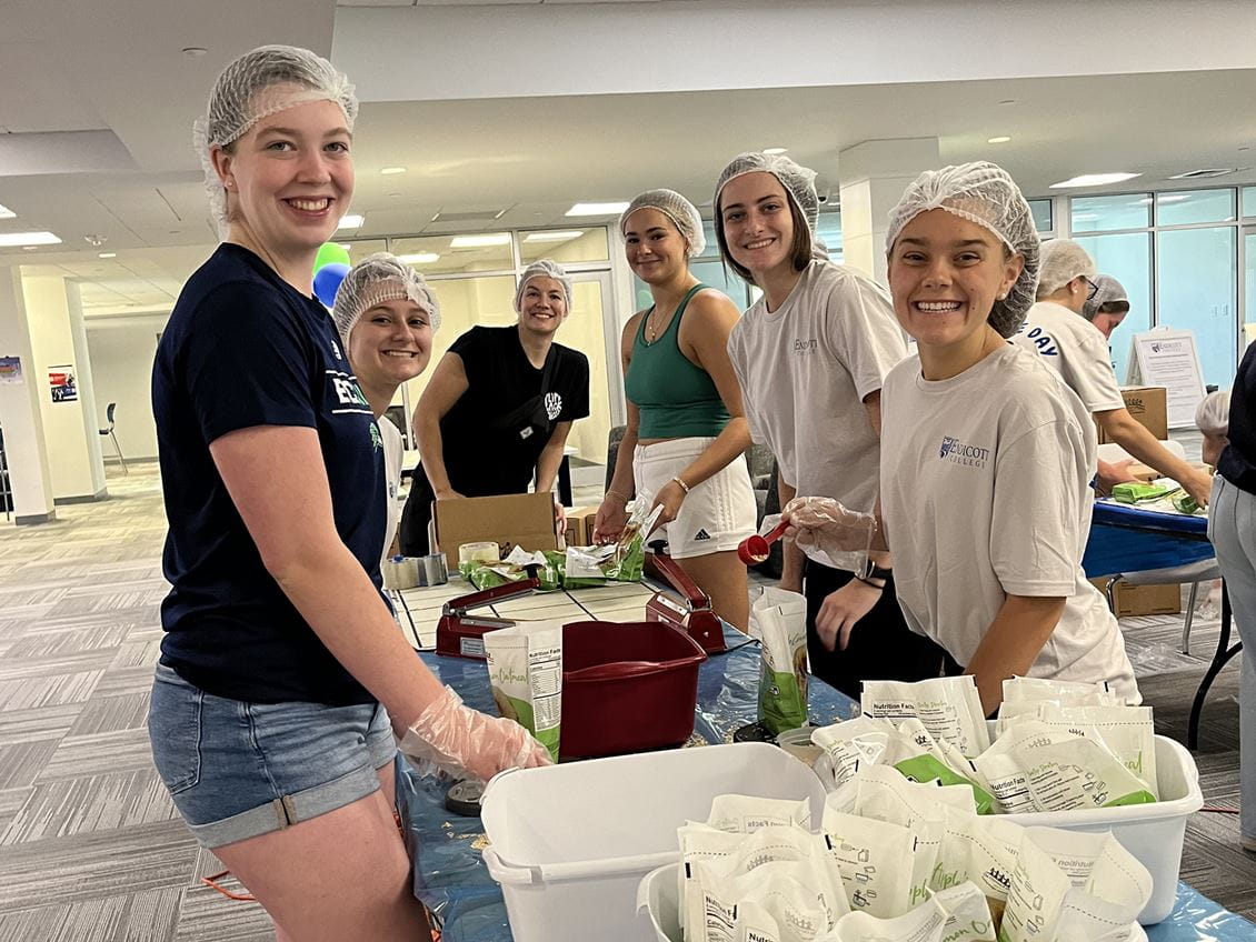 Endicott College students doing into community service 