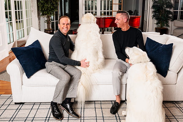 Bryan Cain with his husband Colby and their dogs