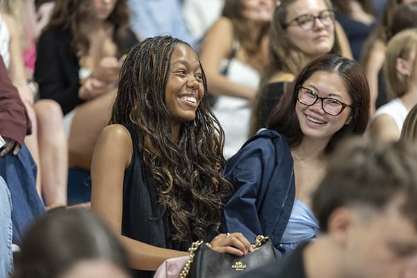 Laughing students at 2026 Inauguration & Convocation, Endicott College