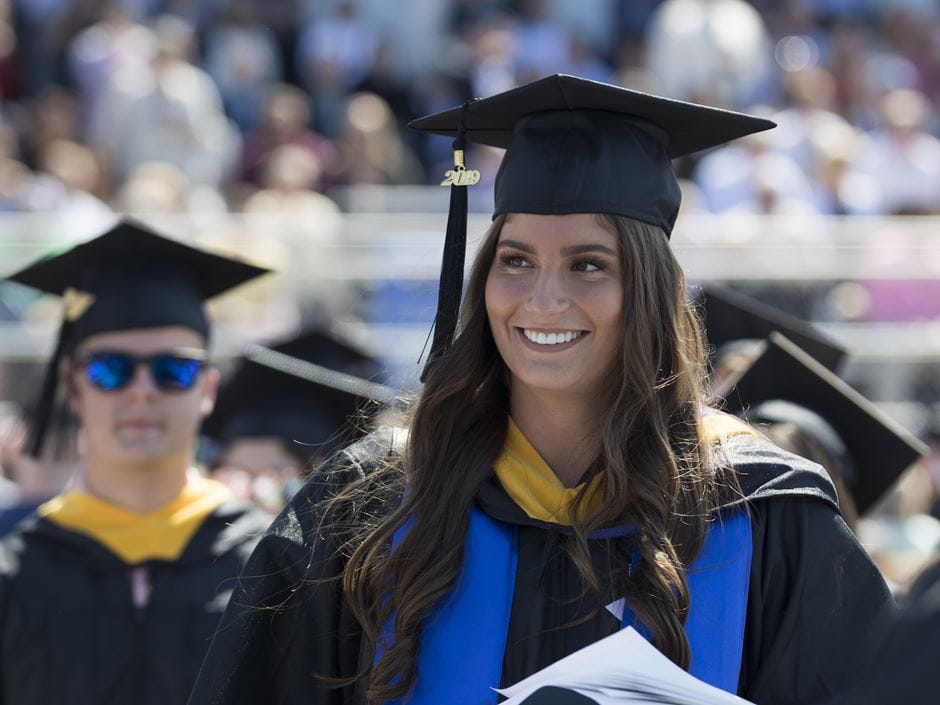 Students prepare to get their diplomas at Endicott College's 2019 Commencement Exercises; photo by David Le.