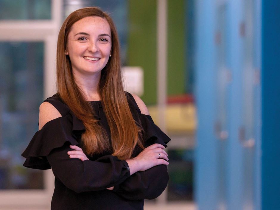 Smiling posed photo of Jamie Espinola crossing her arms