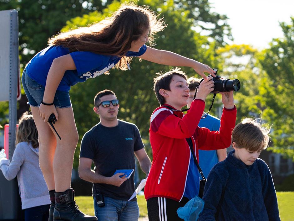 Conservation Club students using a camera