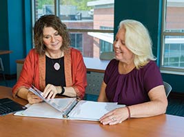 Endicott's Enid Larsen and a Van Loan student