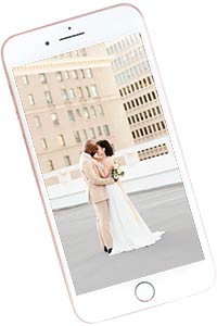 bride and groom embrace on iphone picture