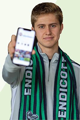 male student holding out phone