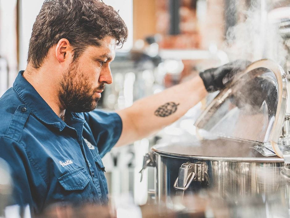 brewer at work in brewery