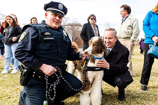 Officer Elliot Lanciani, Gary, and President Steven R. DiSalvo, Ph.D. 