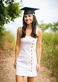 Endicott Class of 2020 graduate Alexandra O'Brien poses by the beach