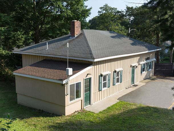 a view of a tan colored house