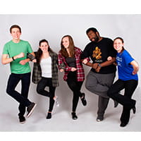 five kids locking arms for a group photo