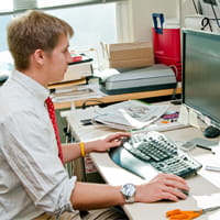 Intern sitting at desk at internship 