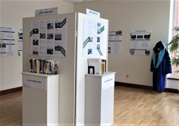 Endicott's Building A Legacy Exhibit at the Archives and Museum wall of photos showing year's of work