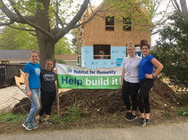 Endicott College students volunteering