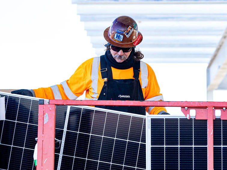 Man working on solar panels